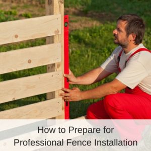Man in Red Overalls Installing a Wooden Fence | America Fence